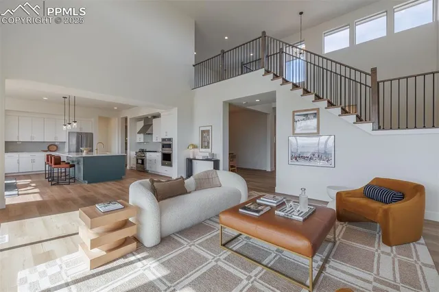 a living room with furniture and a rug