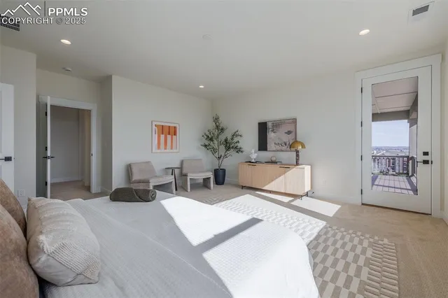 a bed room with a bed and a chair