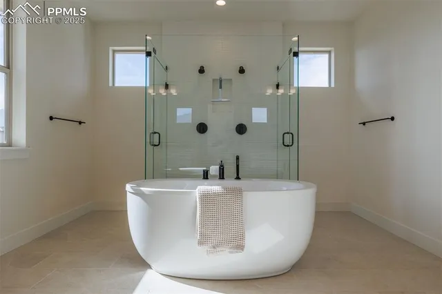 a white bath tub sitting in a bathroom