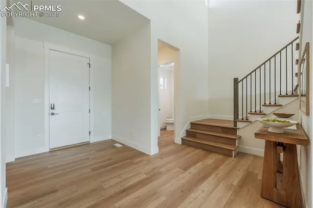 a view of entryway with wooden floor