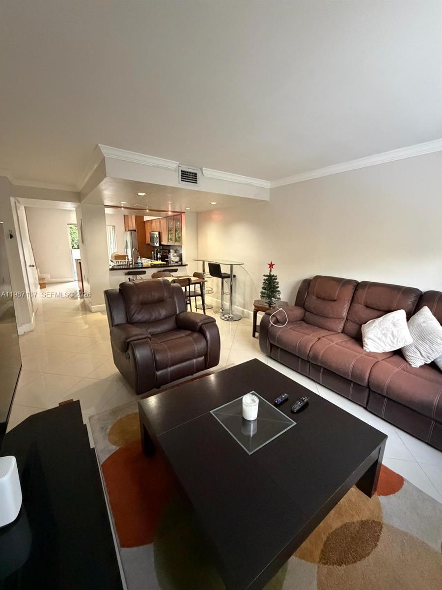 8240 Southwest 149th Court, Unit 7202 Miami, FL 33193 - Photo 3 of 11 a living room with furniture and a couch