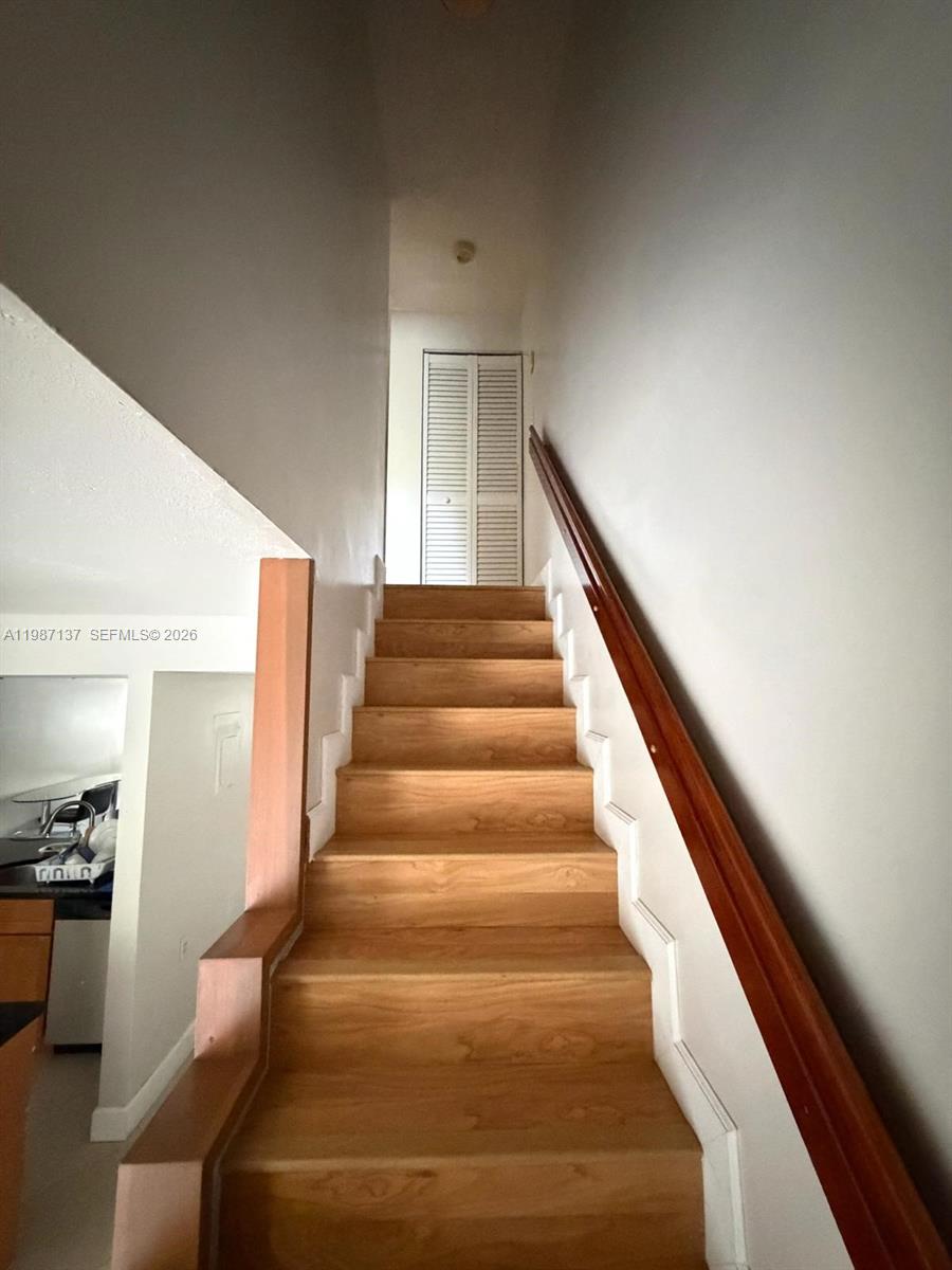 8240 Southwest 149th Court, Unit 7202 Miami, FL 33193 - Photo 9 of 11 a view of entryway and hall with wooden floor