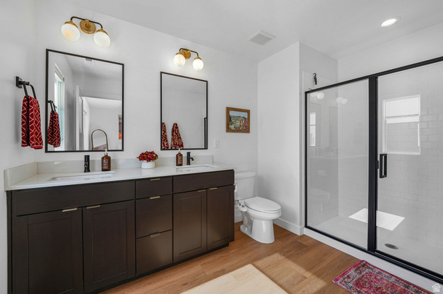 493 East Alice Way Layton, UT 84041 - Photo 15 of 31 Full bath with double vanity, a stall shower, and light wood finished floors