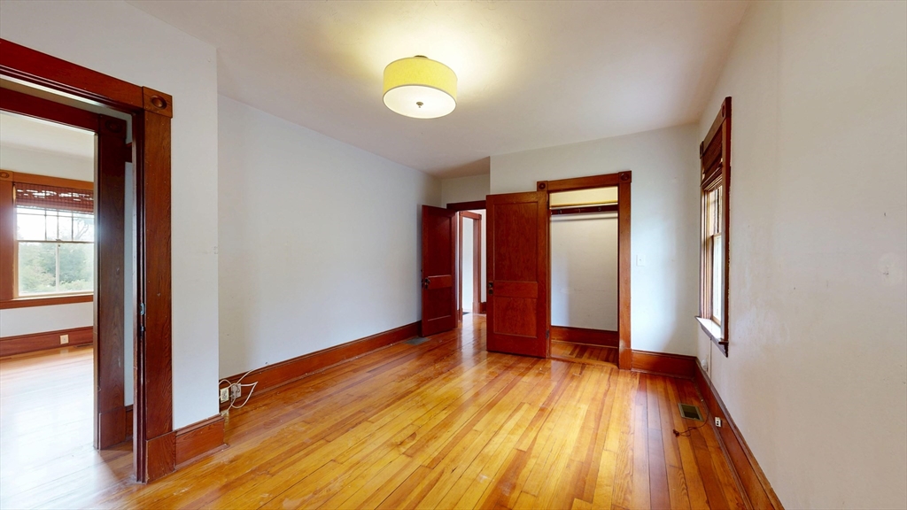 15 Slab Bridge Road Freetown, MA 02702 - Photo 12 of 39 a view of an empty room with wooden floor and a window