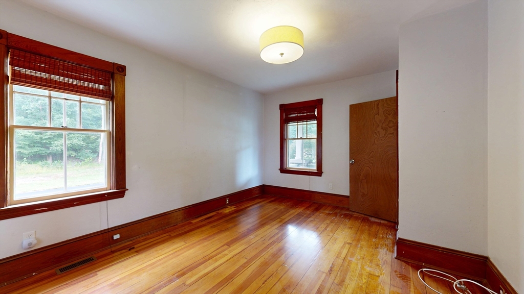 15 Slab Bridge Road Freetown, MA 02702 - Photo 13 of 39 a view of empty room with wooden floor and fan