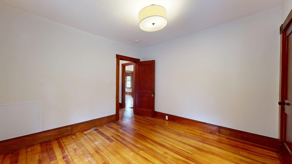 15 Slab Bridge Road Freetown, MA 02702 - Photo 16 of 39 a view of an empty room with wooden floor and a window