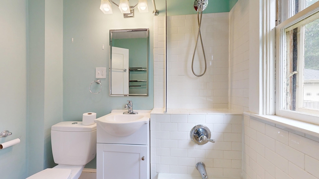 15 Slab Bridge Road Freetown, MA 02702 - Photo 18 of 39 a bathroom with a granite countertop sink and a mirror
