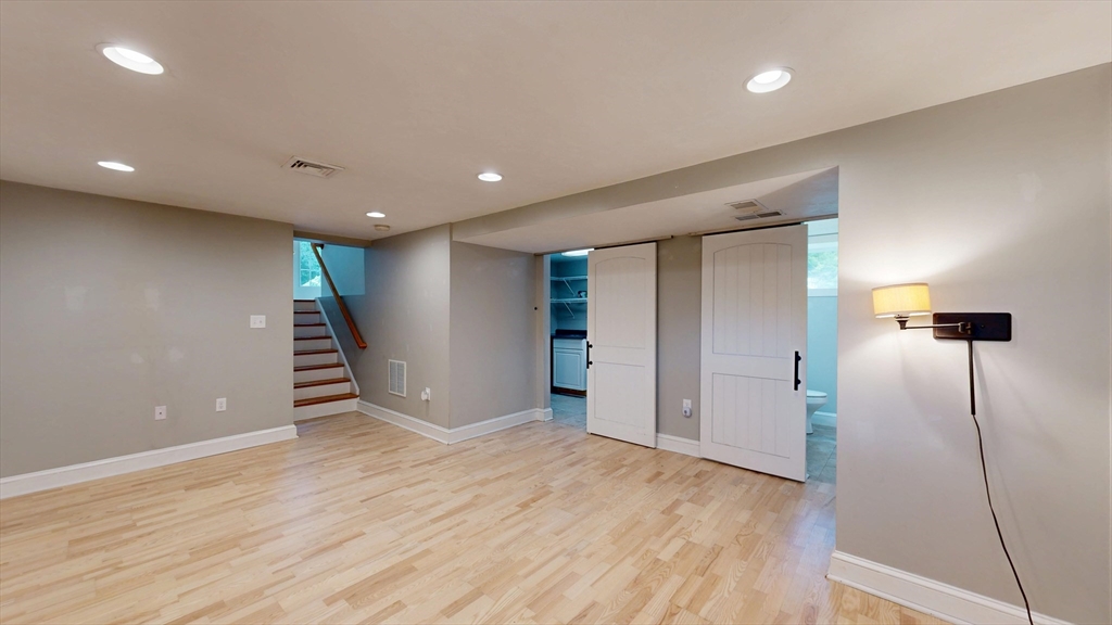 15 Slab Bridge Road Freetown, MA 02702 - Photo 19 of 39 a view of an empty room with wooden floor and a window