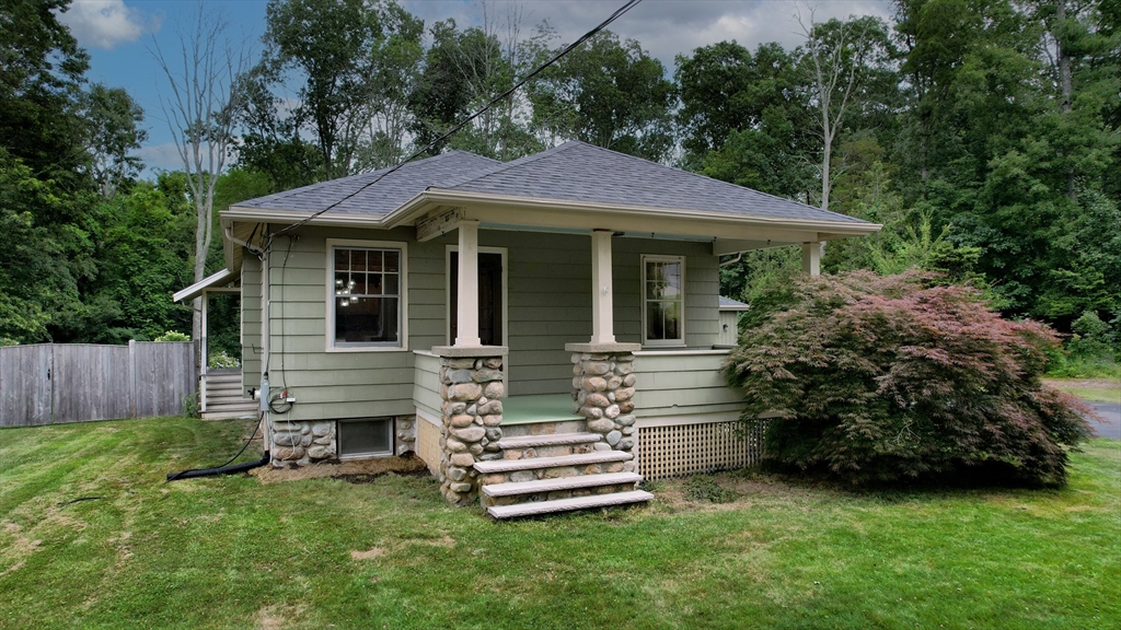 15 Slab Bridge Road Freetown, MA 02702 - Photo 2 of 39 a front view of a house with a garden
