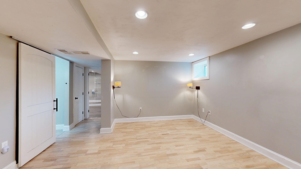 15 Slab Bridge Road Freetown, MA 02702 - Photo 21 of 39 wooden floor in an empty room with a window