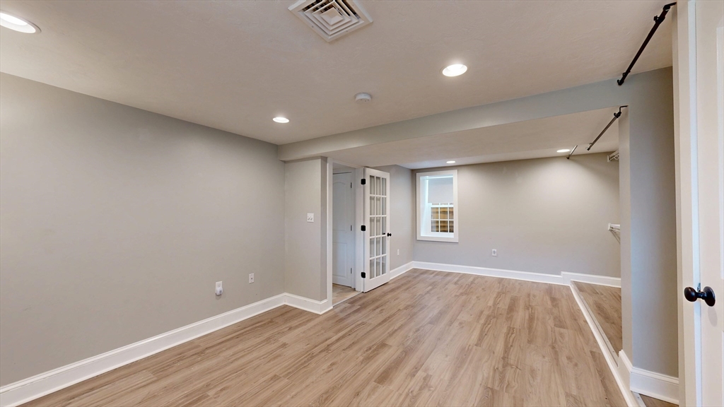 15 Slab Bridge Road Freetown, MA 02702 - Photo 23 of 39 wooden floor in an empty room with a window
