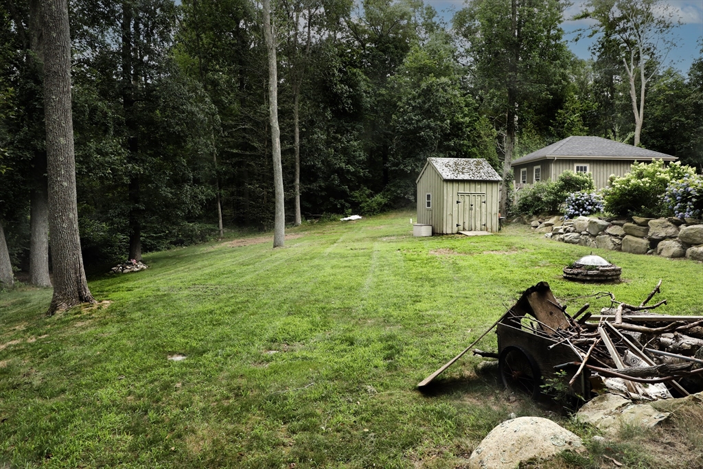 15 Slab Bridge Road Freetown, MA 02702 - Photo 33 of 39 a backyard of a house with table and chairs