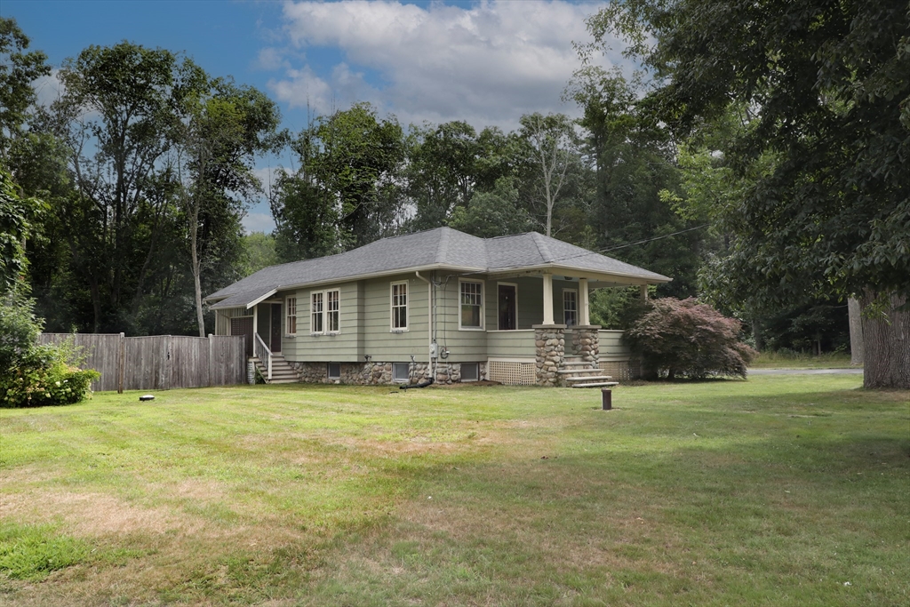 15 Slab Bridge Road Freetown, MA 02702 - Photo 36 of 39 a front view of a house with a garden