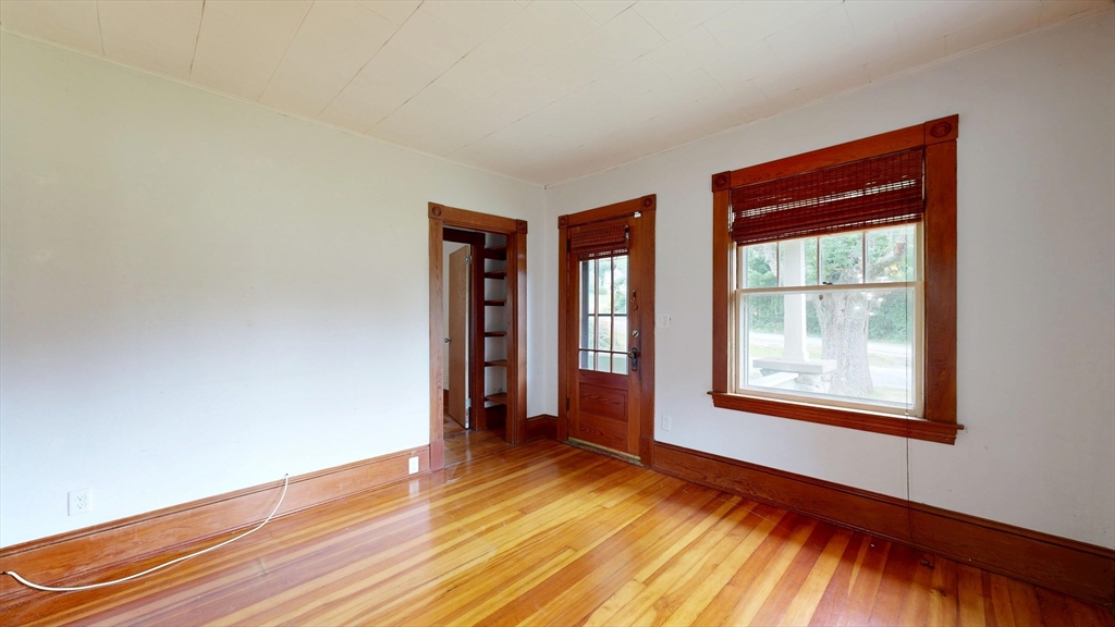 15 Slab Bridge Road Freetown, MA 02702 - Photo 4 of 39 an empty room with wooden floor and windows