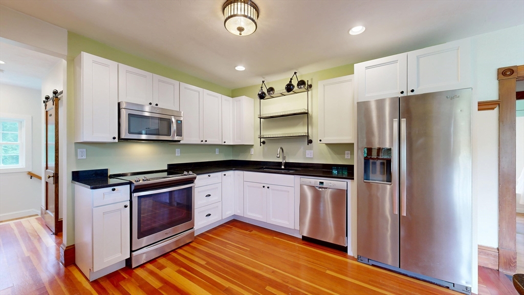 15 Slab Bridge Road Freetown, MA 02702 - Photo 9 of 39 a kitchen with stainless steel appliances granite countertop a refrigerator sink and stove
