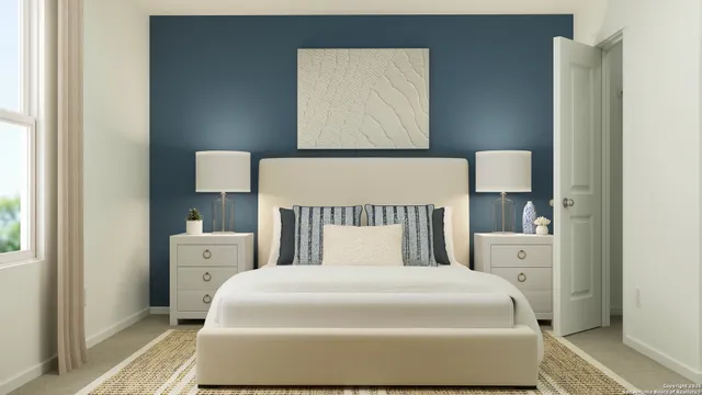 a bedroom with a bed and a night stand