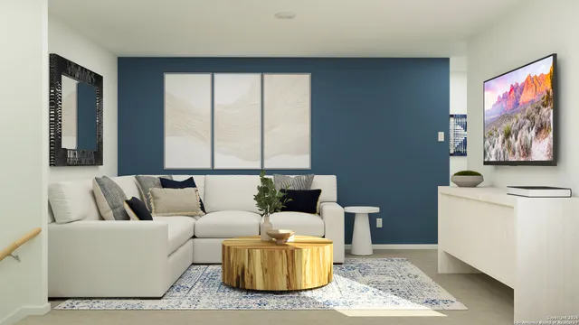 a living room with furniture and a rug