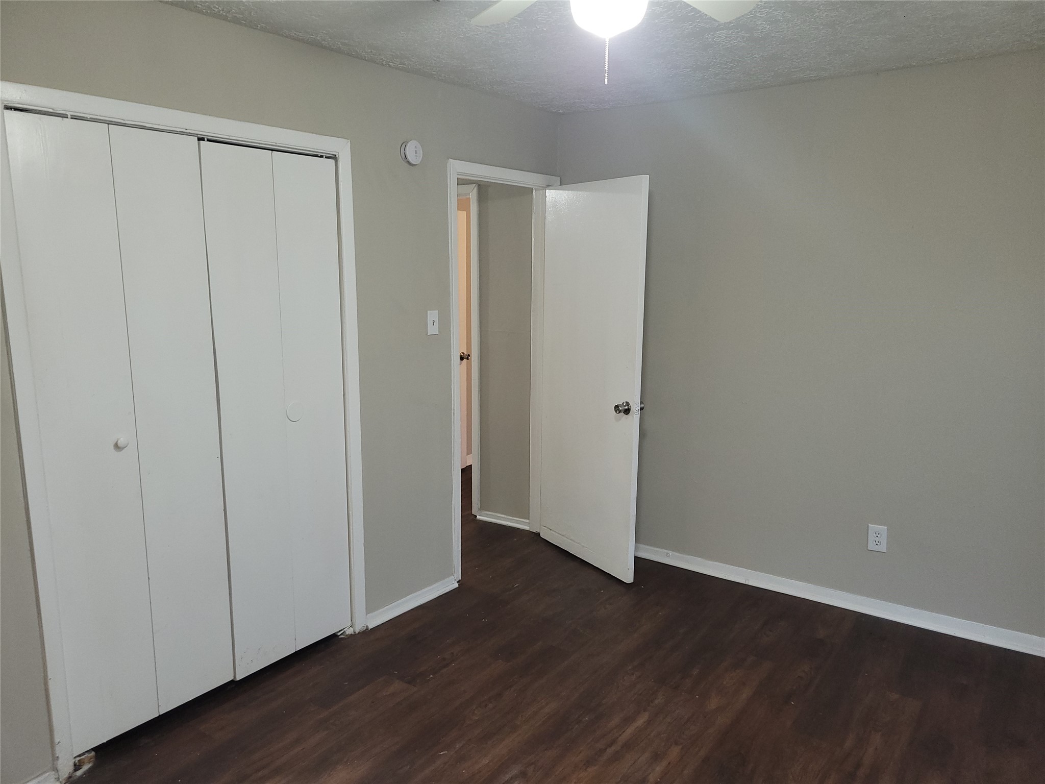 15810 Boonridge Road Houston, TX 77053 - Photo 12 of 15 a view of an empty room with wooden floor