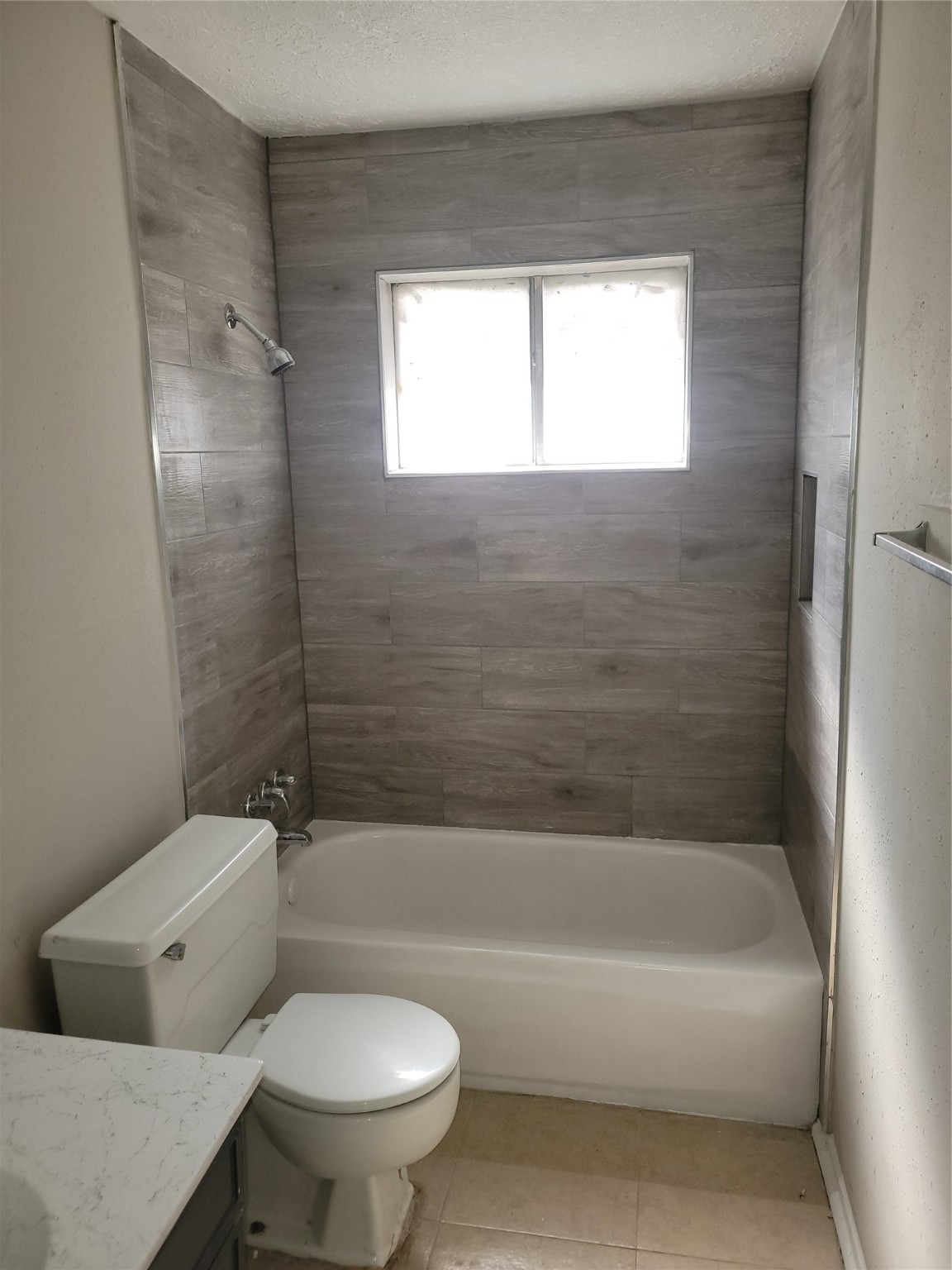 15810 Boonridge Road Houston, TX 77053 - Photo 9 of 15 a bathroom with a toilet and a bath tub