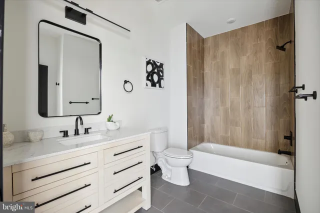 a bathroom with a toilet a sink and a bathtub