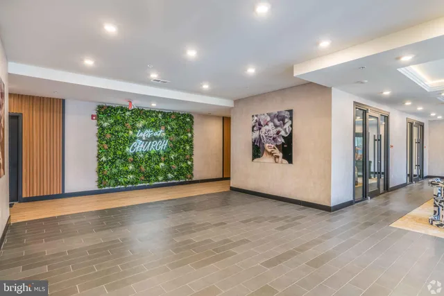 a view of a room with wooden floor and window