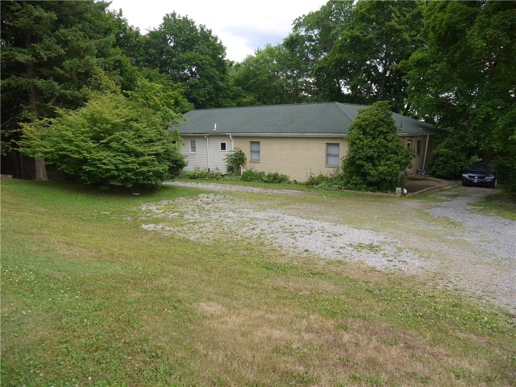 105 Evans City Road Butler, PA 16001 - Photo 1 of 25 Tucked back from the road on a 3.18 acre lot, this sprawling ranch offers many possibilities.