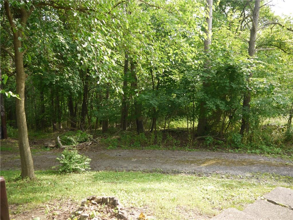105 Evans City Road Butler, PA 16001 - Photo 2 of 25 Wooded views of property from driveway to house.