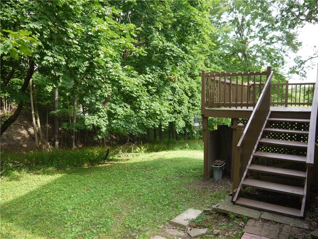 105 Evans City Road Butler, PA 16001 - Photo 11 of 25 Freshly painted deck stairs leading up to expansive deck.