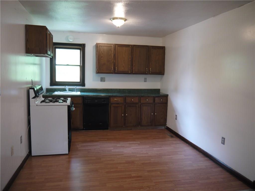 105 Evans City Road Butler, PA 16001 - Photo 14 of 25 One of two Kitchens that includes stove, dishwasher & disposal in both. One kitchen has refrigerator.