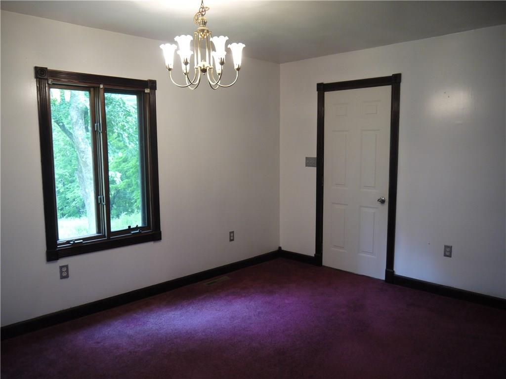 105 Evans City Road Butler, PA 16001 - Photo 15 of 25 Large dining room with wooded views out back.