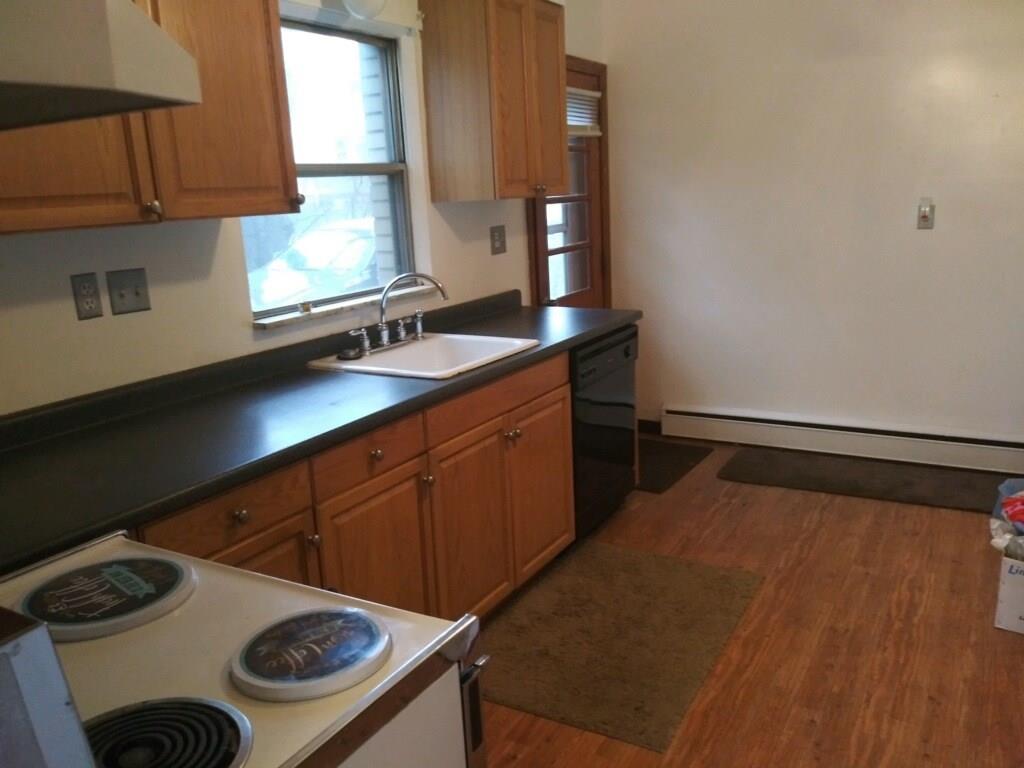 105 Evans City Road Butler, PA 16001 - Photo 5 of 25 One of two kitchens. This one on tenant side is updated with newer flooring, counters, sink and fresh painted walls.