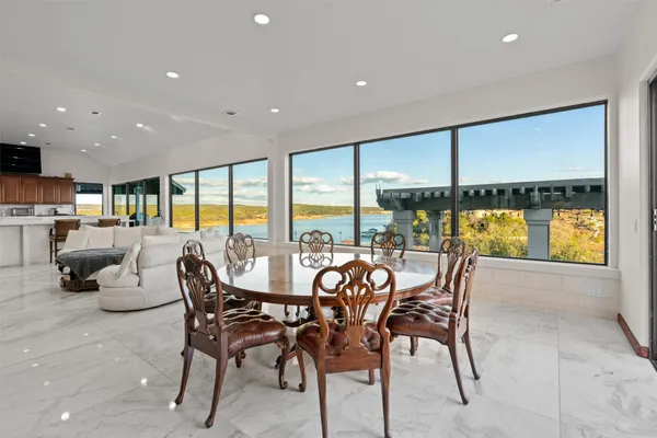 a dining room with furniture water view and ocean view