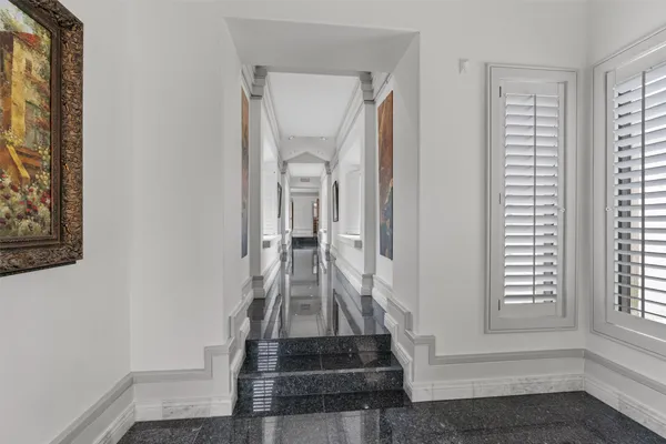 a view of front door with hallway and stairs