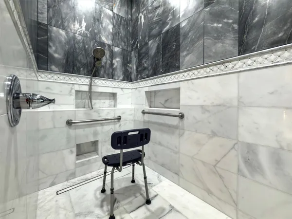a bathroom with a bathtub and shower
