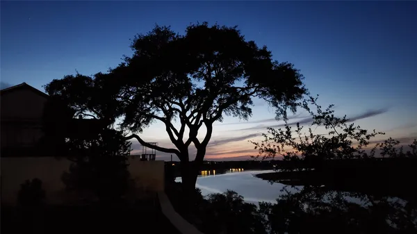 a view of a house in a yard and a yard