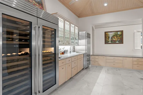 a bathroom with a granite countertop sink mirror and
