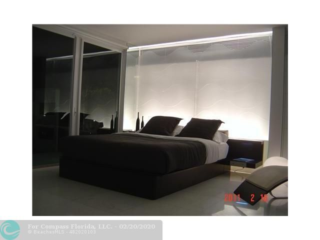 a view of a living room with a flat screen tv