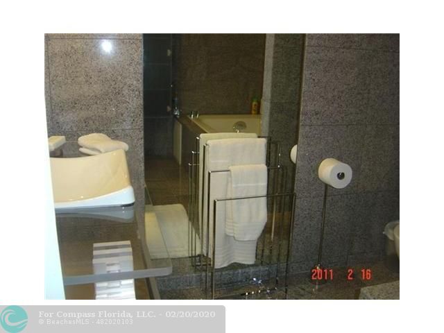 a picture of a bench in front of a building