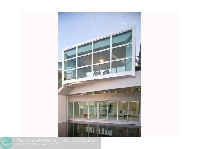 a bedroom with a bed and a night stand