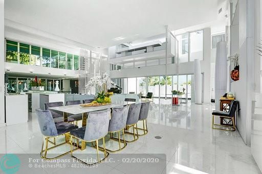 a living room with furniture large window and a flat screen tv