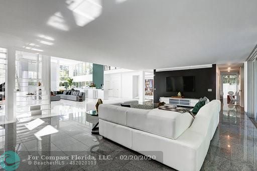 a view of an outdoor dining space with a table and chairs