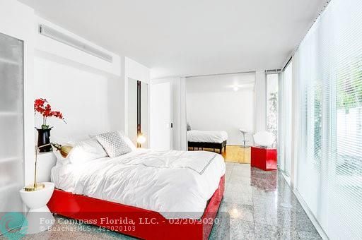 a view of a patio with table and chairs and wooden floor