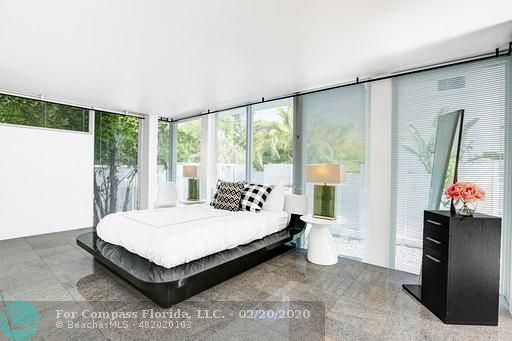 a view of living room with furniture and a large window
