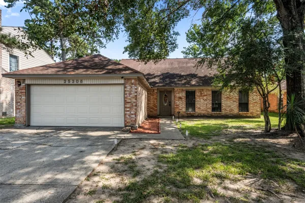 a house with a tree in front of it