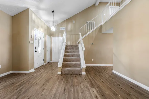 a view of entryway with wooden floor