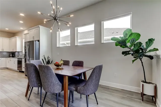 a workspace with furniture window and wooden floor