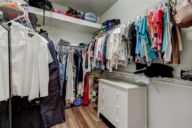 a bedroom with a bed and a desk