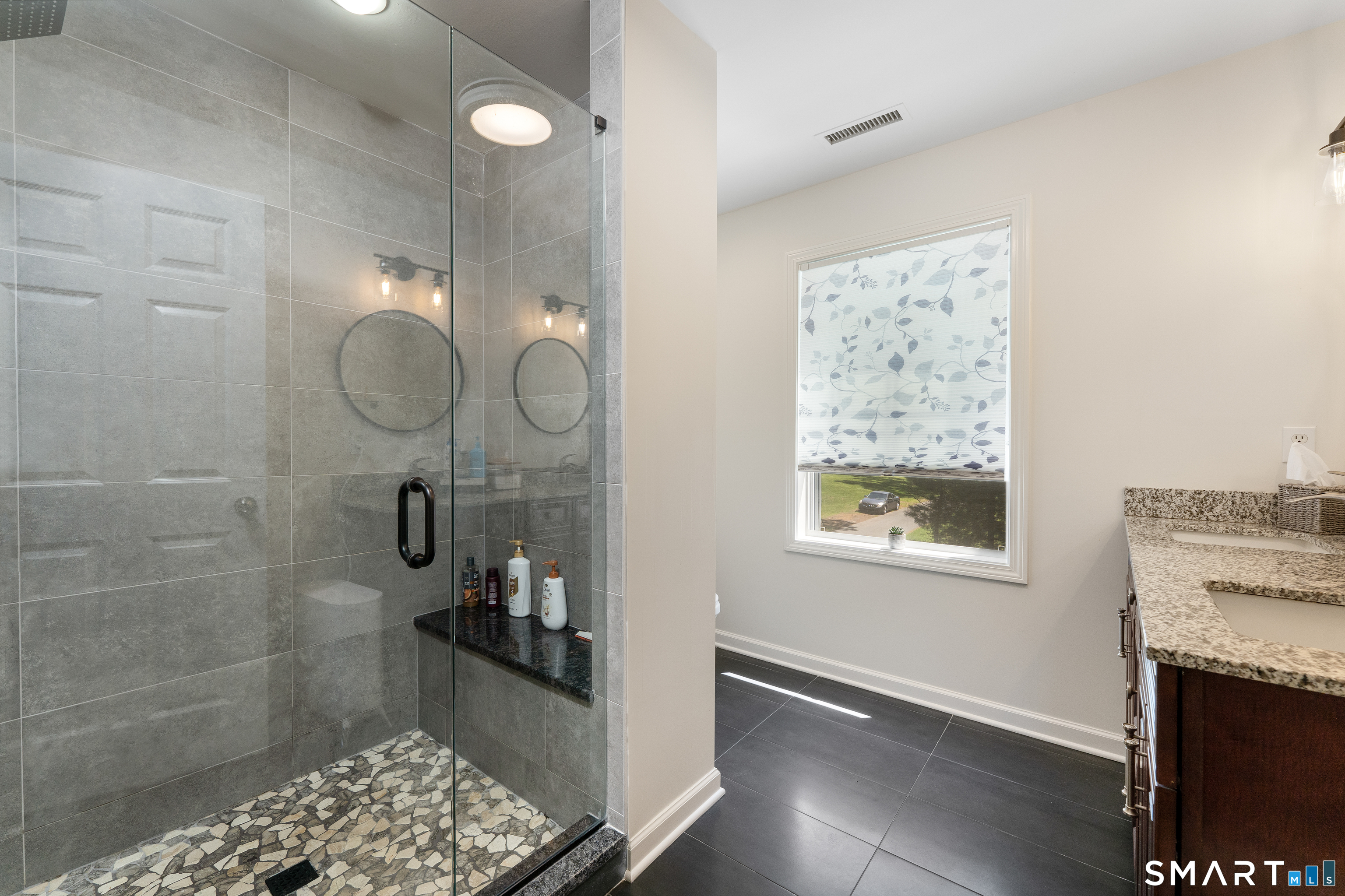261 Spring Road North Haven, CT 06473 - Photo 27 of 39 a bathroom with a sink and a mirror