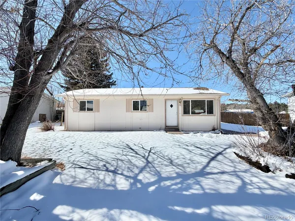 a house with trees in the background