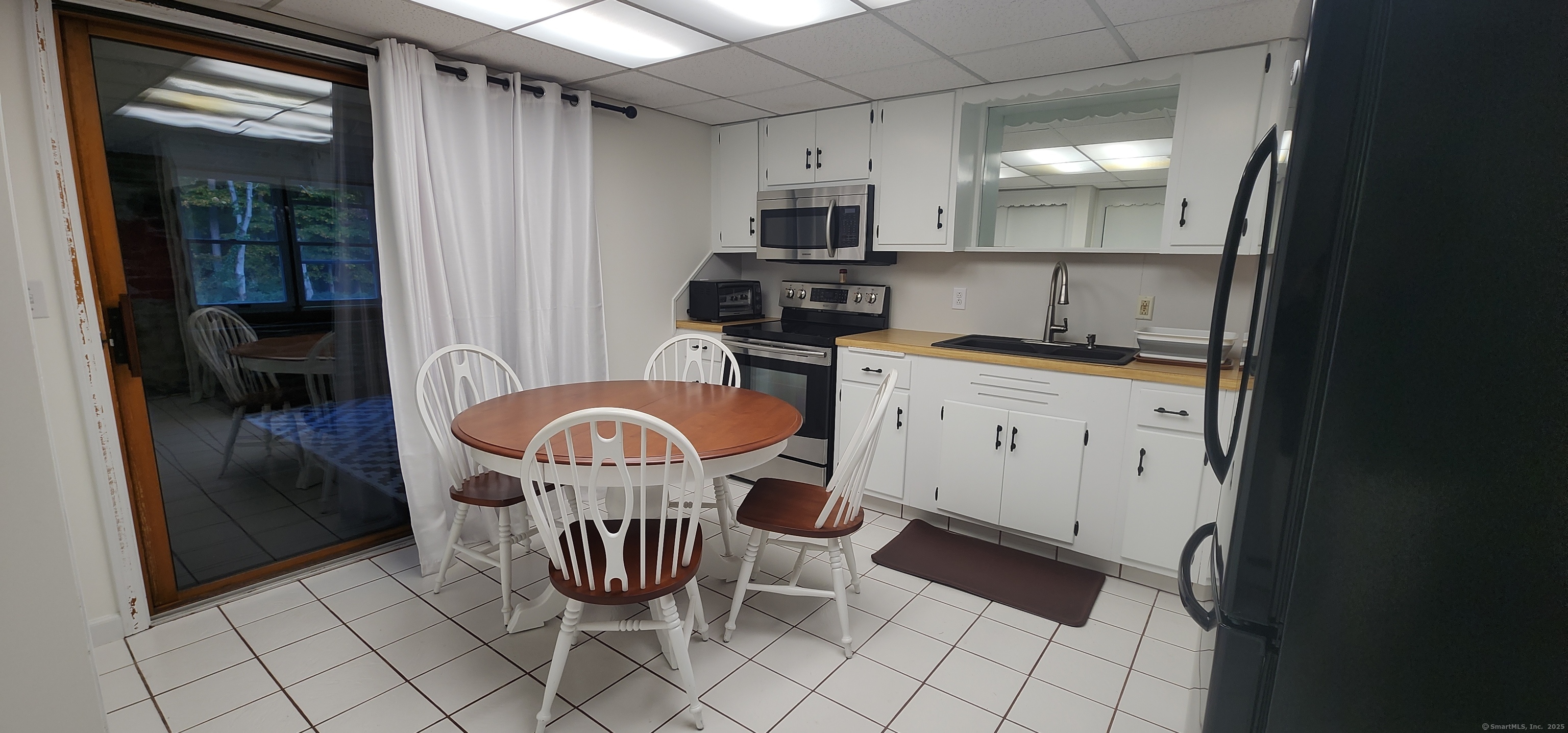 96 Stanavage Road Colchester, CT 06415 - Photo 4 of 9 a kitchen with stainless steel appliances granite countertop a stove a sink and a refrigerator